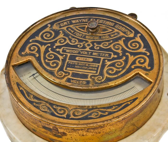 late 19th century ornamental cast bronze "wood type" flush mount switchboard volmeter with original certification label signed by thomas duncan