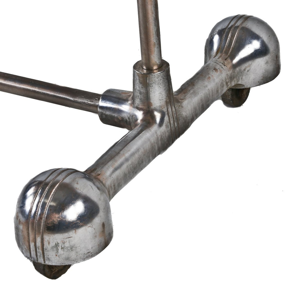 c. 1930's american art deco style mobile machine age tubular steel clothing store garment or clothing rack with distinctive incised line caster hoods