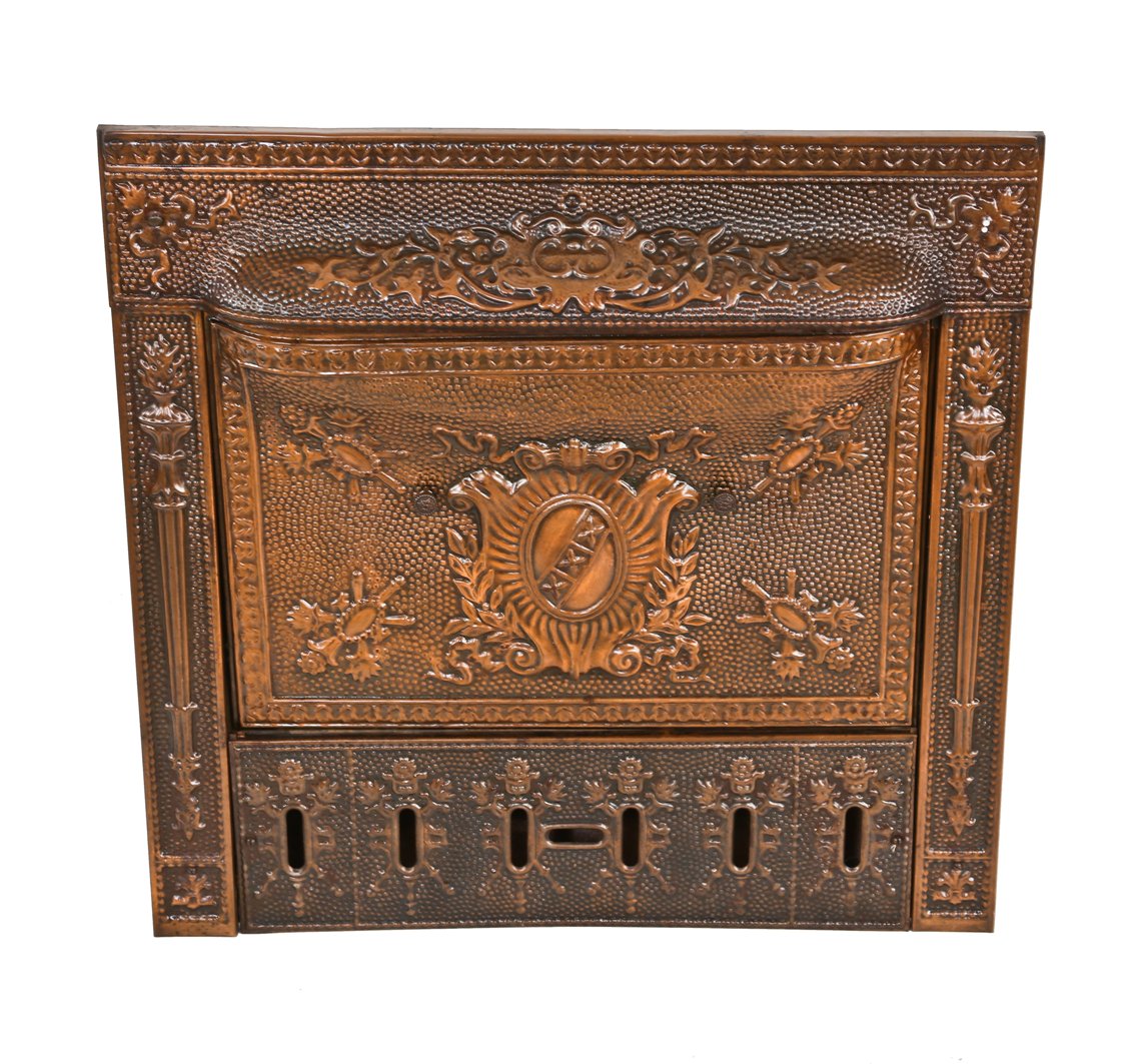 hard to find all original and well-maintained late 19th century copper-plated ornamental steel and cast iron interior residential fireplace gas insert with intact summer cover