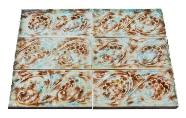all original and matching late 19th or early 20th century antique american embossed interior residential majolica glazed mottled finish fireplace surround tiles