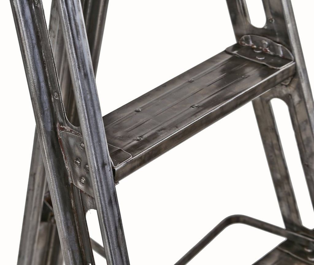 exceptional c. 1930's american industrial refinished brushed and sanded riveted joint collapsible heavy gauge steel ladder with multiple reinforced rungs