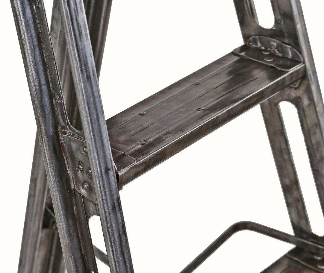 exceptional c. 1930's american industrial refinished brushed and sanded riveted joint collapsible heavy gauge steel ladder with multiple reinforced rungs