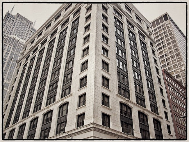 original early 20th century single antique american exterior northwestern railroad (extant) commercial or office building black painted cast iron neoclassical style corbel