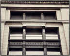 single antique american exterior northwestern railroad (extant) commercial or office building black painted cast iron neoclassical style corbel