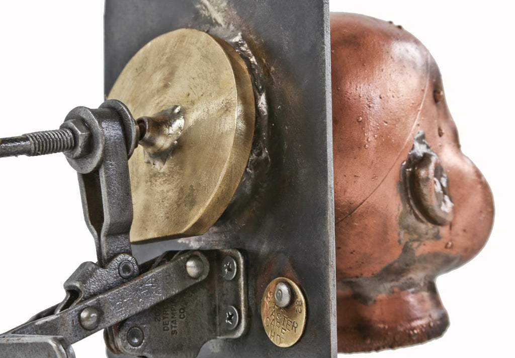 visually distinctive c. 1960's refinished american vintage industrial toy factory copper doll head mold with reconfigured welded joint steel moutning bracket