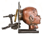 visually distinctive c. 1960's refinished american vintage industrial toy factory copper doll head mold with reconfigured welded joint steel moutning bracket