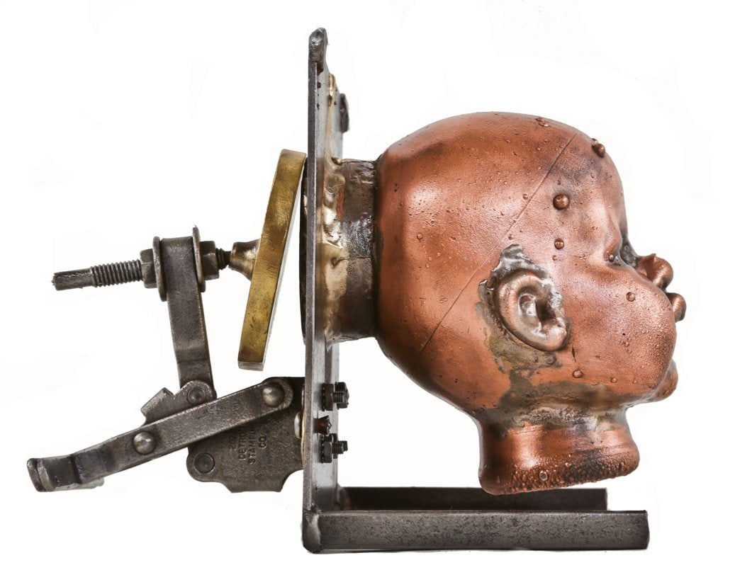visually distinctive c. 1960's refinished american vintage industrial toy factory copper doll head mold with reconfigured welded joint steel moutning bracket