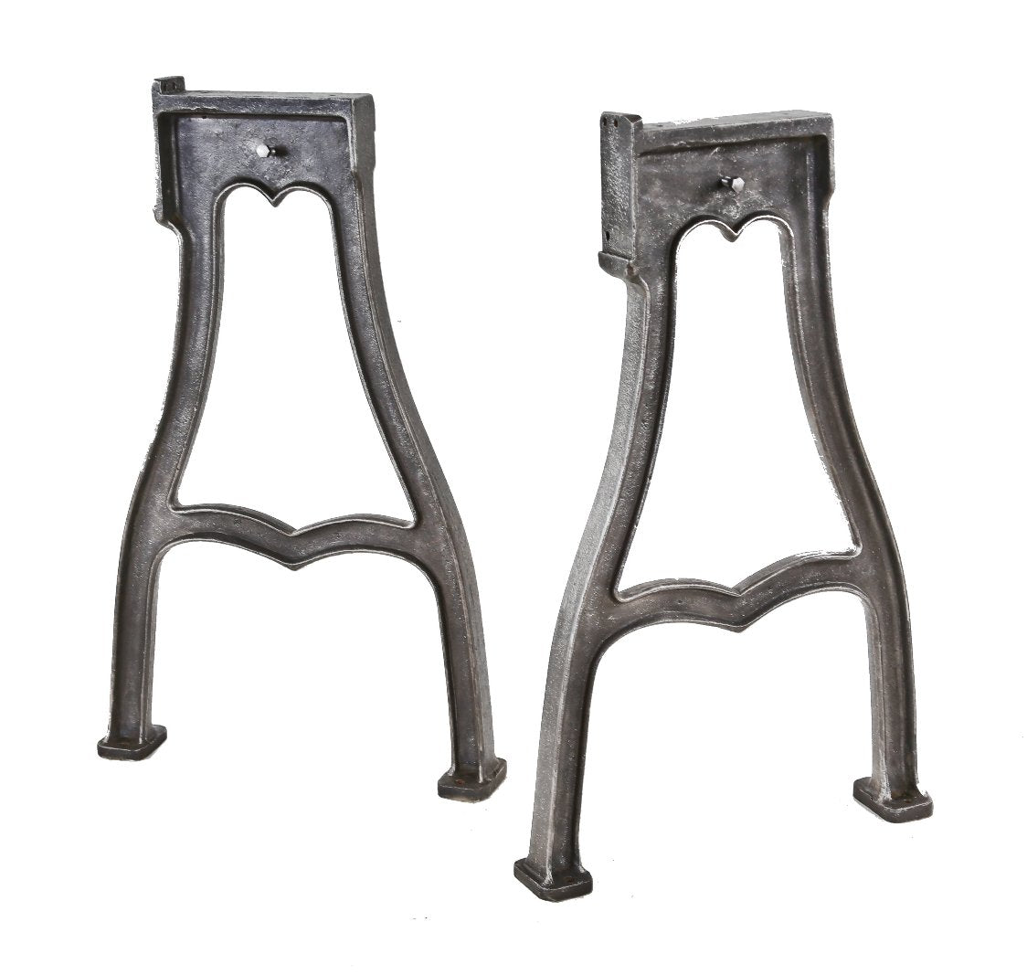 matching set of towering early 20th century incredibly heavy duty ornamental cast iron american industrial commercial woodworking lathe machine bases or legs