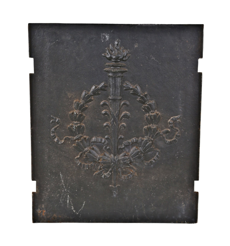 late 19th or early 20th century antique american ornamental black enameled cast iron interior residential fireplace fireback with laurel wreath and torche