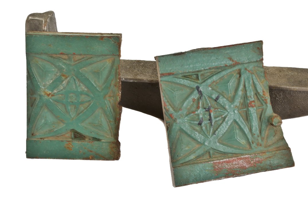 two early 20th century diminutive weathered green enameled ornamental single-sided cast iron hoops building facade window casing or mullion fragments