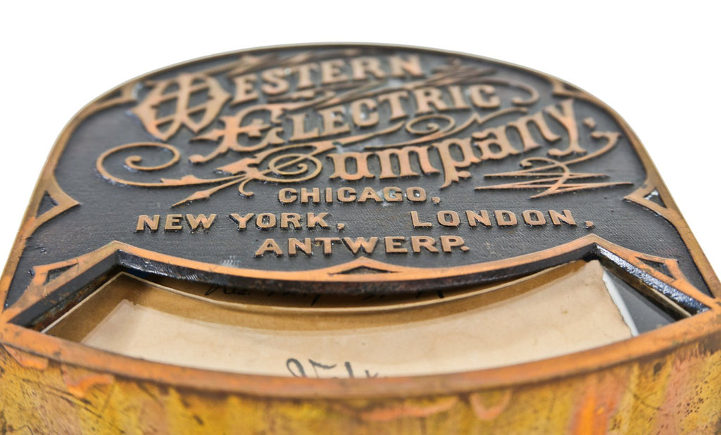 partially intact very rare late 19th or early 20th century heavily ornamented solid cast brass surface-mount switchboard voltmeter housing with original "volts" scale