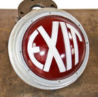 all original and completely functional machine age art deco style interior wall-mount illuminated exit light fixture with intact ruby red glass convex-shaped lens