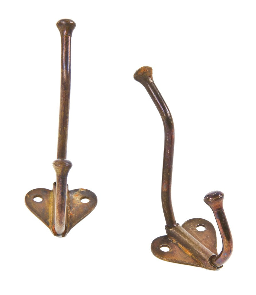 a set of matching original and intact antique american interior residential c. 1920's wall-mount cast iron closet hooks with mostly intact copper-plated finish