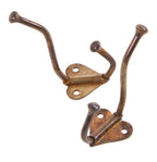 matching pair of original antique american c. 1920's unornamented copper-plated cast iron wall-mount coat hooks with unique heart-shaped backplate