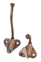 original copper-plated cast iron and wrought steel interior residential wall-mount closet hat or coat hooks salvaged from the john kent russell house