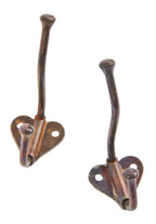 very clean and simple all original matching iron and wrought steel stationary wall-mount clothing hooks salvaged from the closets in the historic john kent russell residence