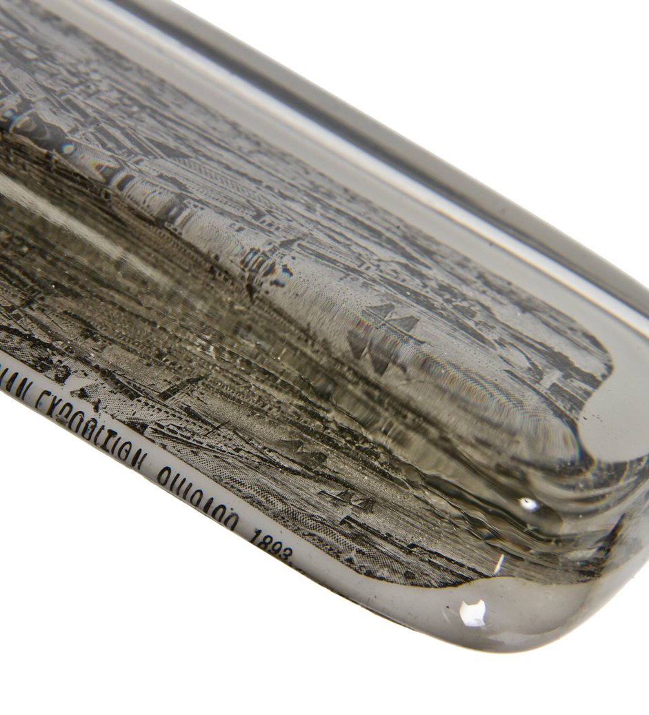 hard to find c. 1893 "world's columbian exposition" solid glass paperweight souvenir with opaque bottom fabricated in the libbey glass kiln located on the fairgrounds