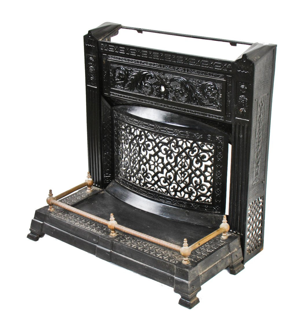 largely intact all original 19th century antique american victorian era baked black enameled coal or wood burning fireplace surround with detachable fender on casters