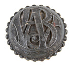 single original c. 1891 interior cast iron elegantly designed monogrammed wainwright building office door handle with a pronounced beaded border or band