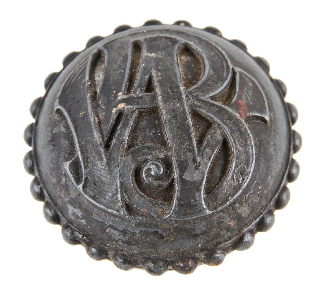 single original c. 1891 interior cast iron elegantly designed monogrammed wainwright building office door handle with a pronounced beaded border or band
