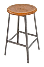 american c. early 1950's industrial four-legged riveted joint angled steel factory machine shop stool with intact stretchers and original circular-shaped seat