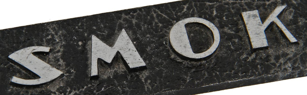 one of two original c. 1930's american art deco style single-sided reinforced cast aluminum surface mount cast aluminum "no smoking" informational sign with black enameled finish