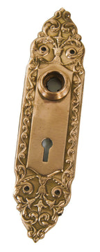 early 20th century original antique american ornamental wrought brass interior residential "mura" pattern single passage door backplate or escutcheon