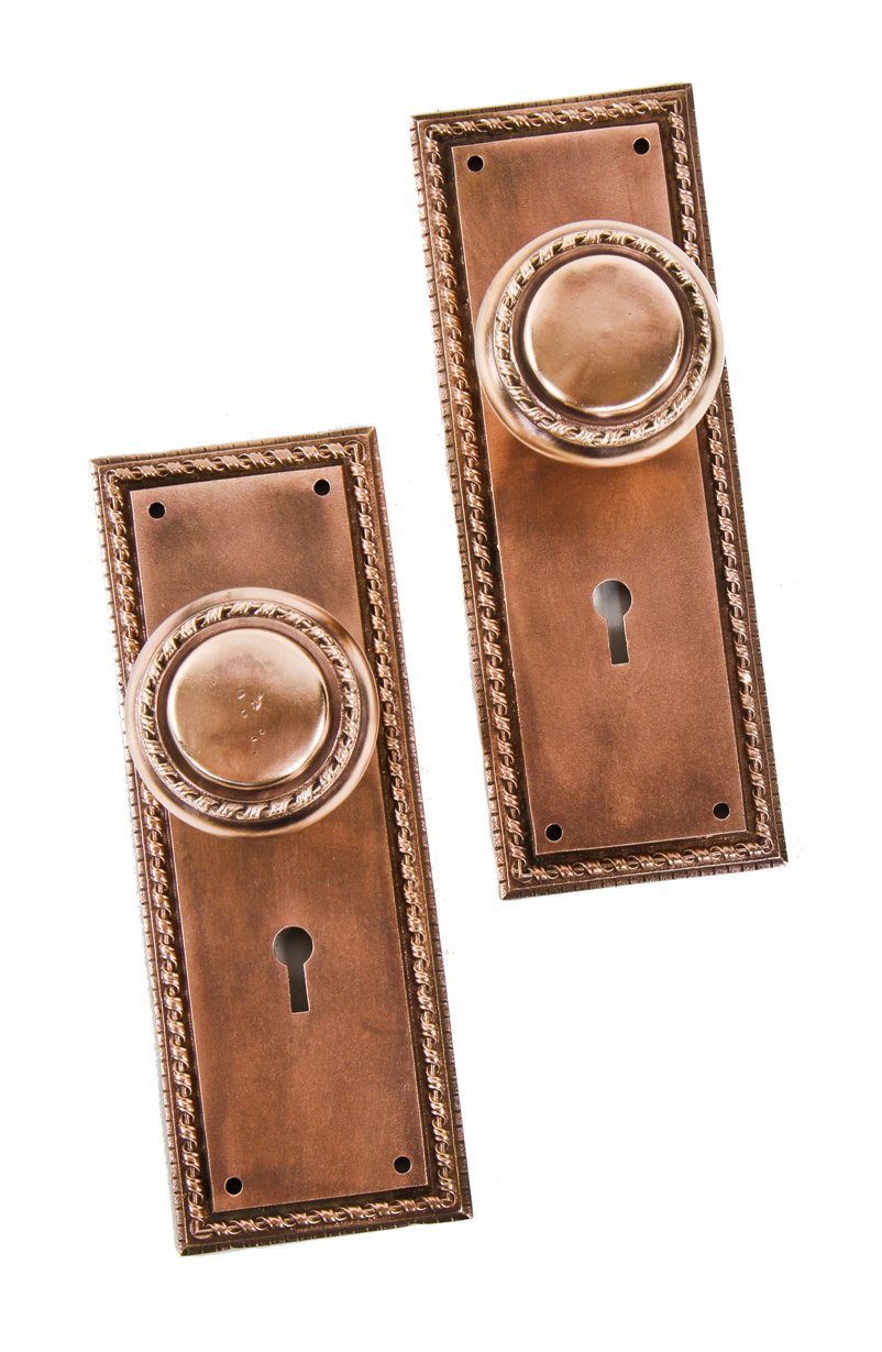 original antique american made interior chicago residential matching ornamental cast bronze neoclassical style doorknobs and escutcheons or backplates