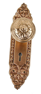 c. 1904 original interior residential ornamental wrought brass "mura" pattern banded rim doorknob with matching single keyhole escutcheon or backplate