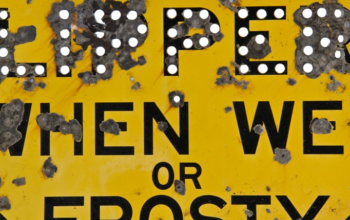 unique oversized c. 1940's vintage american industrial single-sided heavy gauge stamped steel diamond-shaped "slippery when wet cautionary road sign with bright yellow paint finish