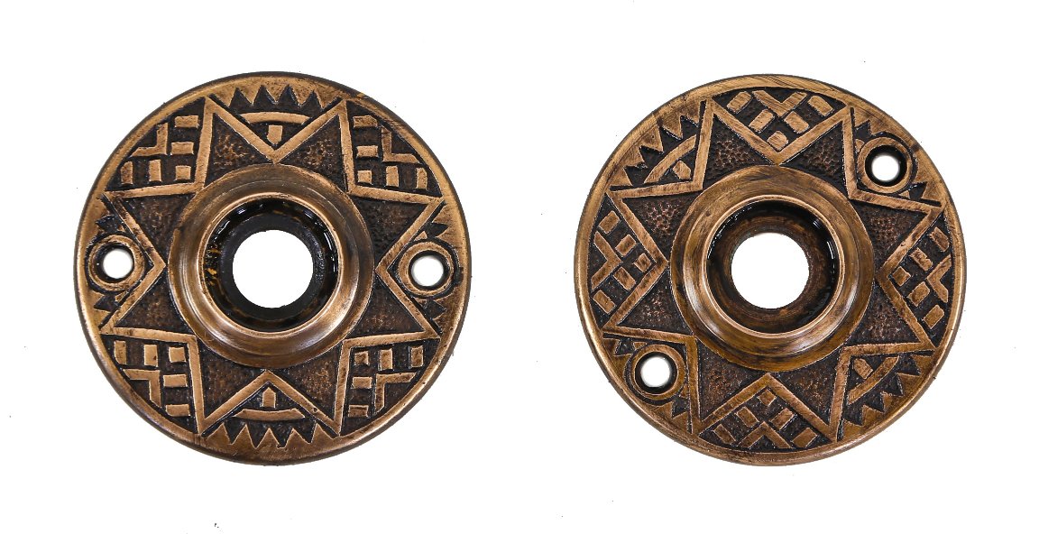 two matching original c. 1880's antique american ornamental cast brass interior residential surface mount passage door rosettes with black enameled inaly