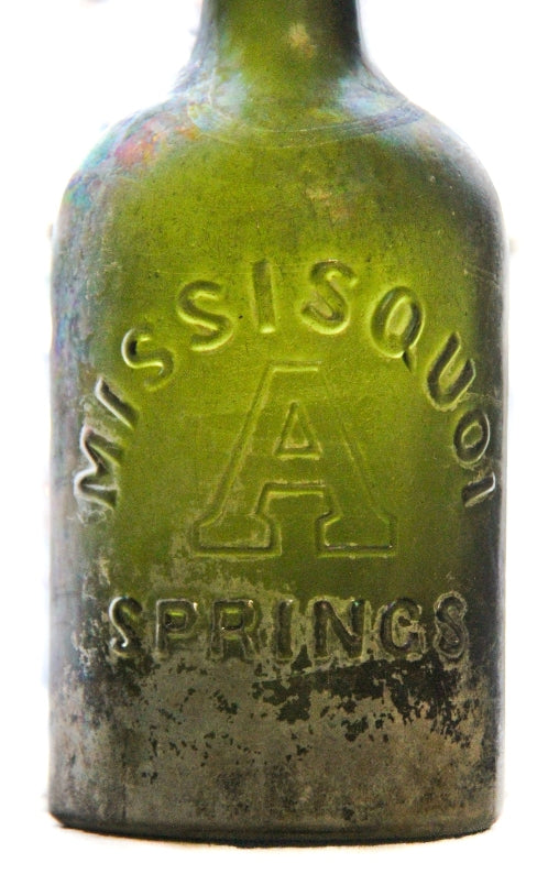 all original and uncleaned (i.e., tumbled) 1860's-1880's antique american dark olive green glass deeply embossed "missisquoi / springs" bottle