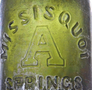 all original and uncleaned (i.e., tumbled) 1860's-1880's antique american dark olive green glass deeply embossed "missisquoi / springs" bottle
