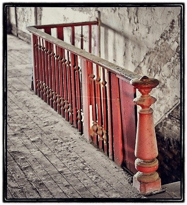 very robust all original c. 1870's original octagonal-shaped red painted solid walnut wood commercial building staircase newel post with top cap