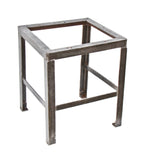 heavily reinforced original c. 1940's american industrial all-welded joint angled steel factory machine shop table base with a brushed and sanded metal finish