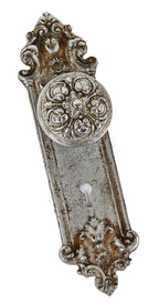 matching early 20th century ornamental chrome plated cast iron "pasco" pattern interior residential doorknob and matching backplate or escutcheon