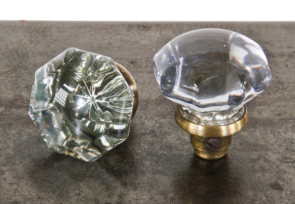two matching all original oversized multi-faceted "crystal" or pressed clear glass interior residential doorknobs with lightly cleaned yellow brass shanks