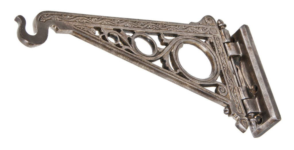 original late 19th or early 20th century heavily ornamented oversized cast iron pivoting drugstore display window hanging show globe bracket with hook