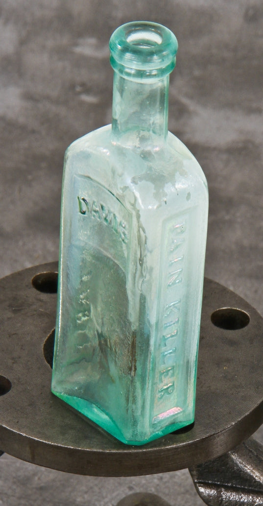 original and intact mid-nineteenth century antique american open-pontiled light blue aqua diminutive medicinal bottle manufactured for perry davis in providence, rhode island.