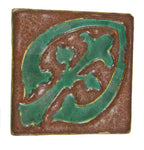 highly sought after all original one of two original new old stock ornamental matte glazed grueby faience tile with distinctive "cucumber green" floral motif