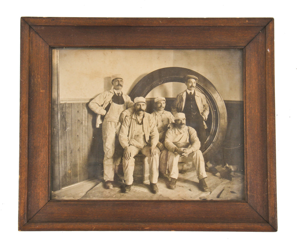 original matted signed gelatin silver print depicting leading oyen artist axel edward soderberg positioned on ladder with brush against a building mural in progress