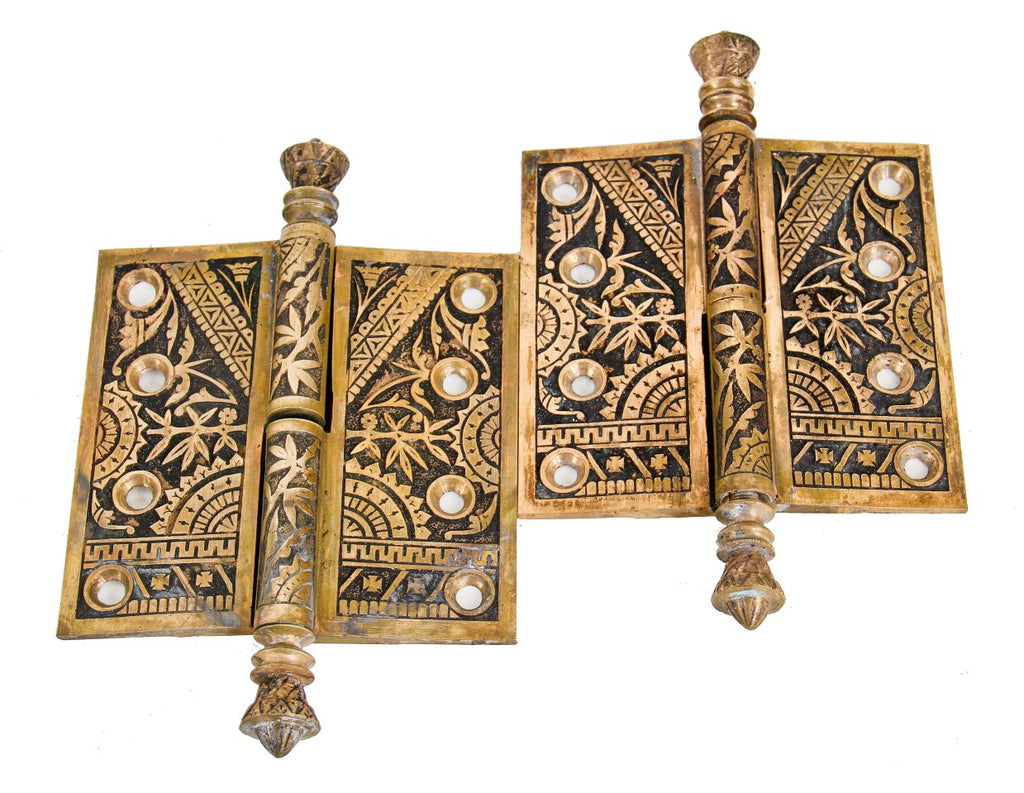 two matching hard to find and highly sough after heavily ornamented cast brass interior residential "bamboo" pattern eastlake style passage door hinges