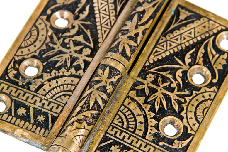 two matching original and largely intact american 19th century eastlake style "bamboo" pattern cast brass ornamented passage door hinges with elegant finials