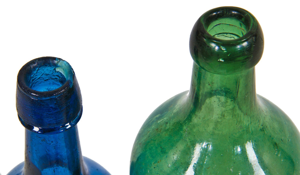 unusual  privy-dug light jade saratoga pint shaped pontiled bottle with high sloping shoulders and a squat neck, finished with an applied blob.