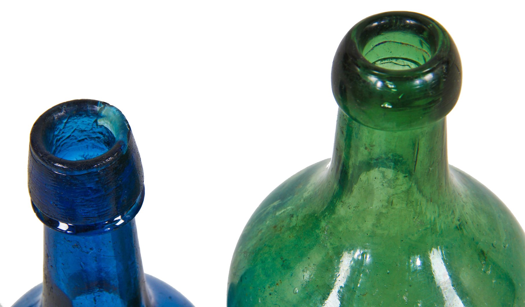 unusual  privy-dug light jade saratoga pint shaped pontiled bottle with high sloping shoulders and a squat neck, finished with an applied blob.