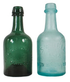 mid-nineteenth century (1860-1870) privy-dug deep blue aqua porter shaped bottle with a twitchell-style applied tapered lip and rounded ring manufactured in new jersey, likely by the bridgeton glass works.