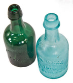 mid-nineteenth century (1860-1870) privy-dug deep blue aqua porter shaped bottle with a twitchell-style applied tapered lip and rounded ring manufactured in new jersey, likely by the bridgeton glass works.