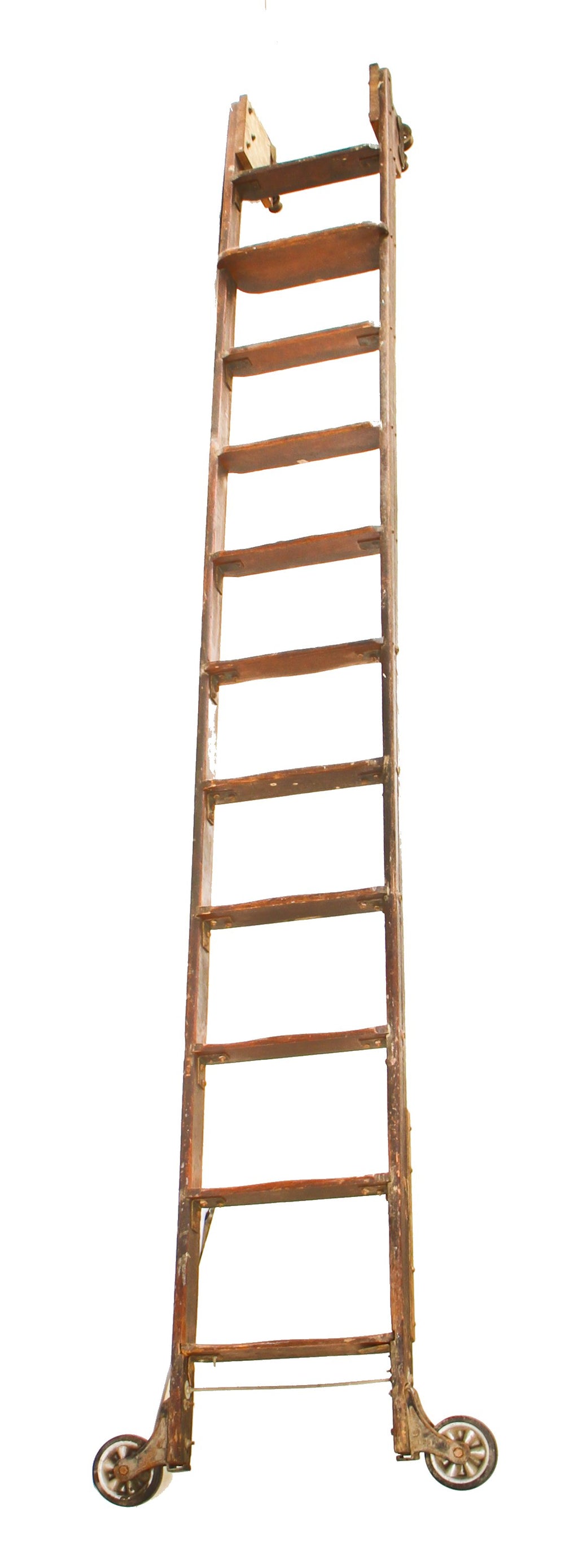 one of two original early 20th century chicago hardware store rolling "library" style varnished oak wood ladder with intact hangers and track