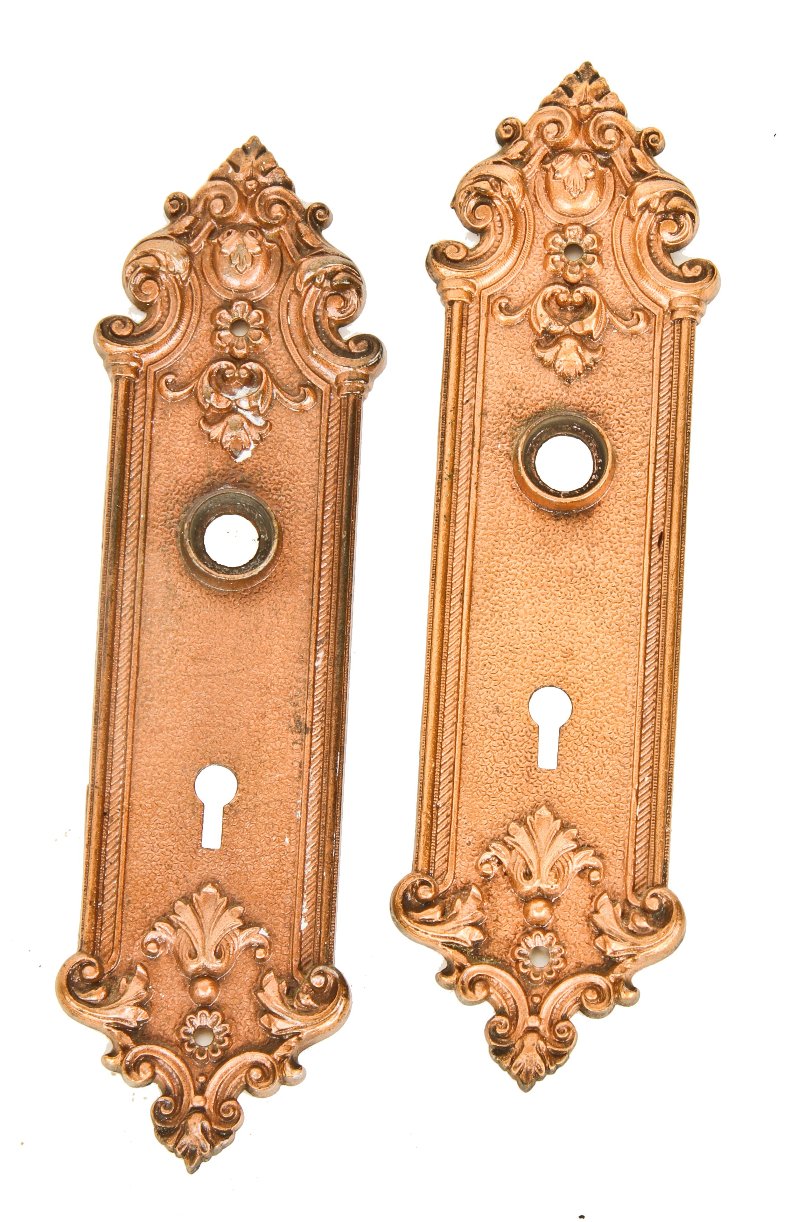 original turn of the century antique american ornamental cast iron "pasco" pattern copper-plated interior residential doorknob backplates with wrought steel thimbles
