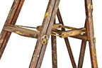 original nicely worn early 20th century american antique industrial oak wood folding ladder with patented opposed cast iron rung or step thru bolt discs